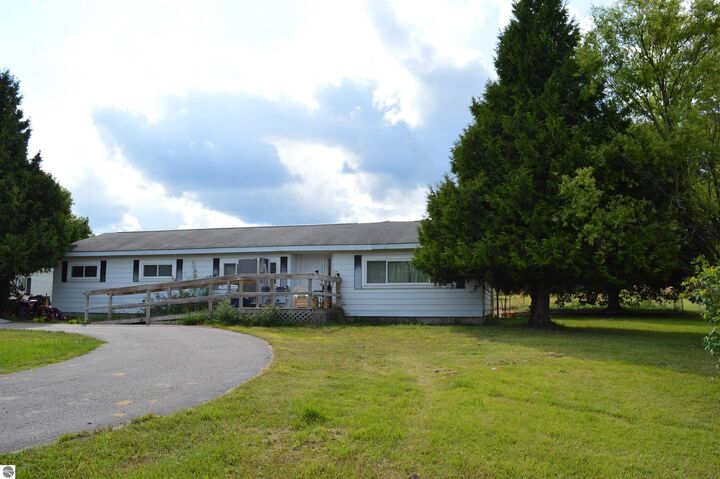 Property Photo:  1167 NE Rosenberg Road  MI 49646 
