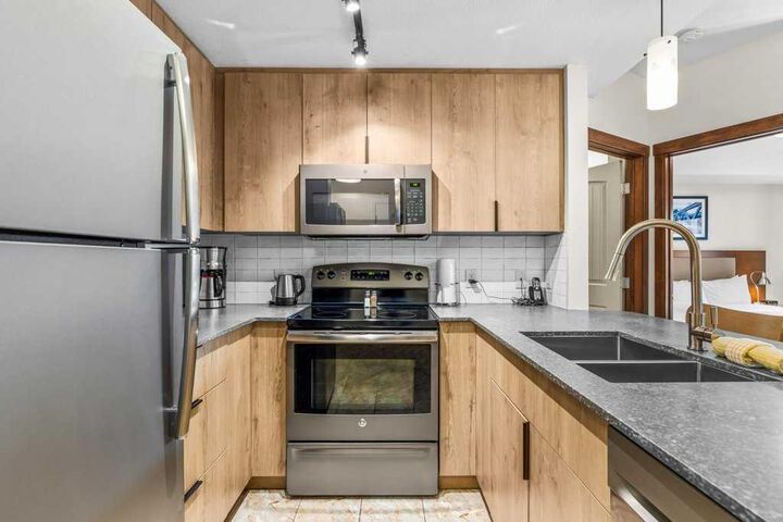 Property Photo: 190 Kananaskis Way 231 AB T1W 3K5