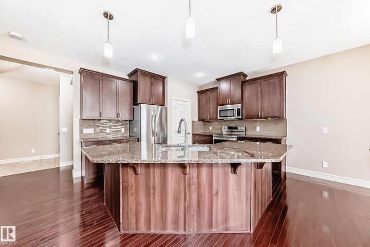 Property Photo: 4151 Alexander Way SW AB T6W 2C8