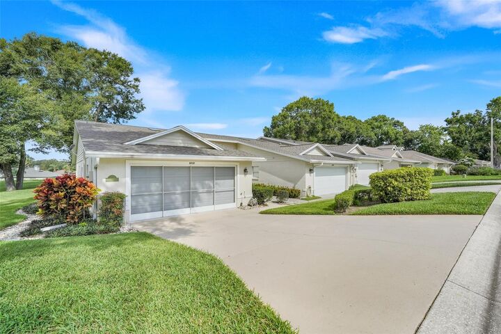 Property Photo:  8737 Village Green Boulevard  FL 34711 