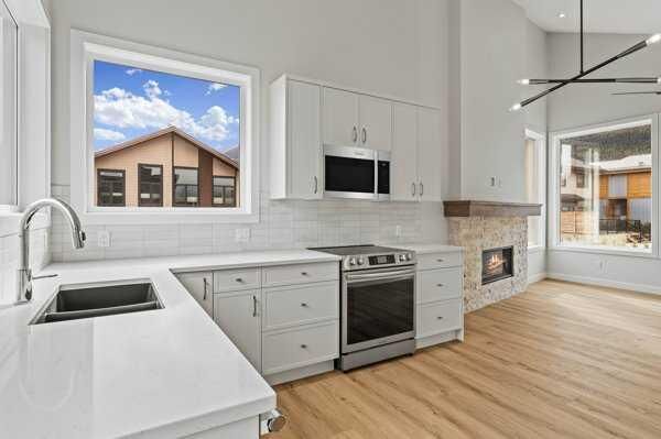 Property Photo:  209 Stewart Creek Rise 203J  AB T1W 0N9 