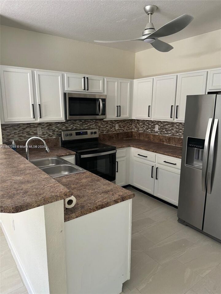 Property Photo:  9153 SW 227th St 1  FL 33190 