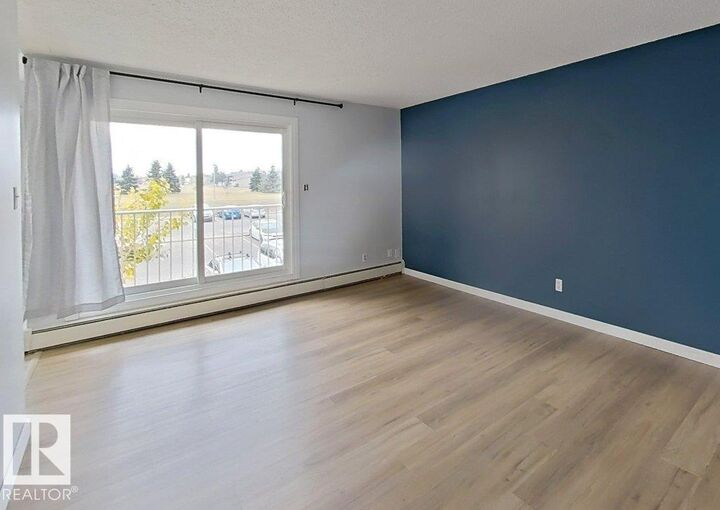 Property Photo:  11245 31 Avenue NW 21  AB T6J 3V5 