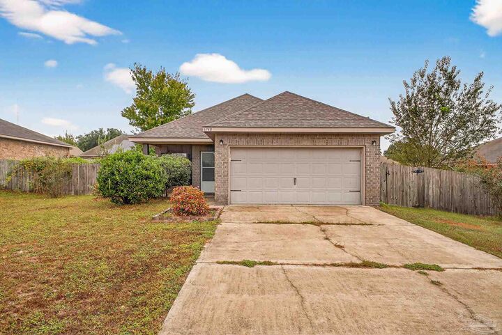 Property Photo: 6740 Cotter Dr FL 32570