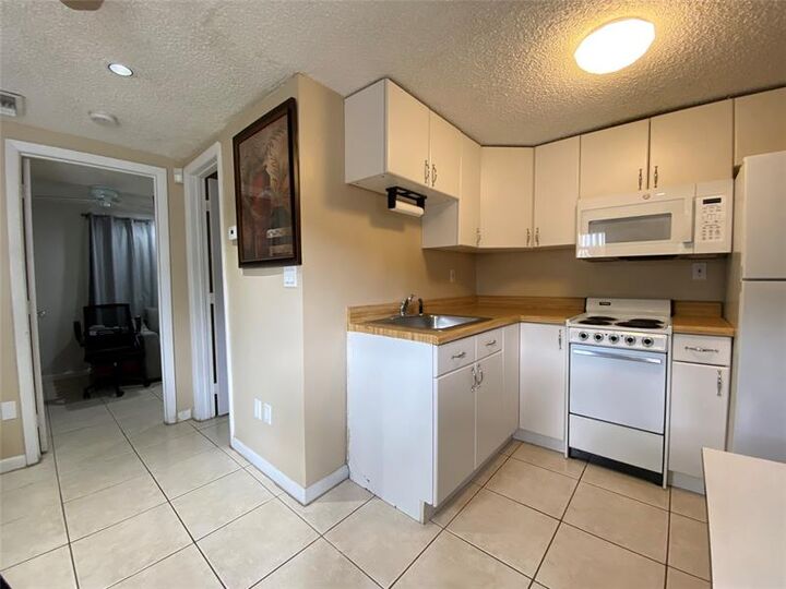 Property Photo:  9600 NW 24th Ave  FL 33147
