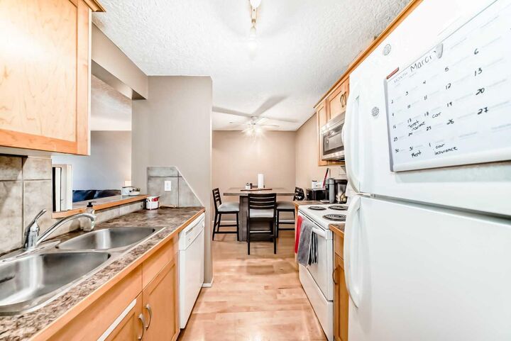 Property Photo:  13045 6 Street SW 3207  AB T2W 5H1