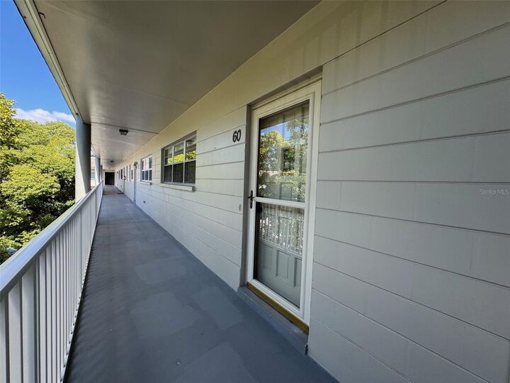 Property Photo:  2440 World Parkway Boulevard 60  FL 33763 