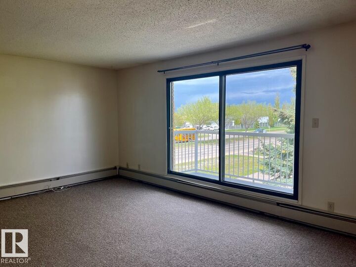 Property Photo:  9405 94 Avenue 302  AB T8L 1N6 