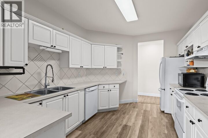 Property Photo:  1940 Richter Street 203  BC V1Y 2N2