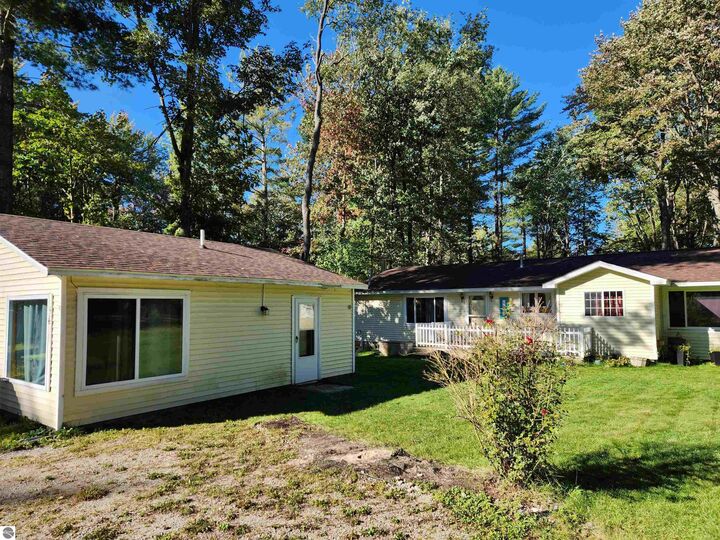 Property Photo:  5611 NE East Shore Drive  MI 49646 