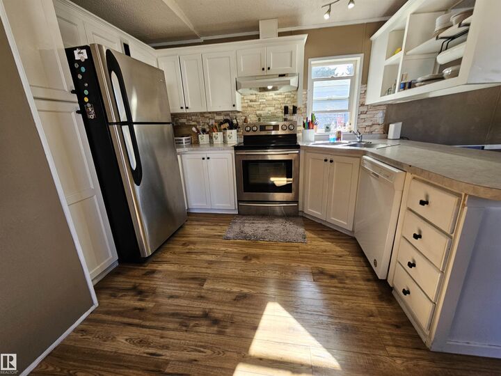 Property Photo:  84 305 Calahoo Road NW  AB T7X 3K7 