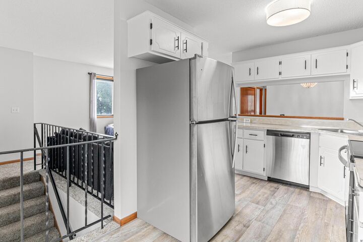 Property Photo:  7610 15th Street Lane N 907  MN 55128 