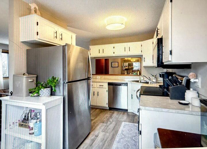 Property Photo:  7610 15th Street Lane N 907  MN 55128 