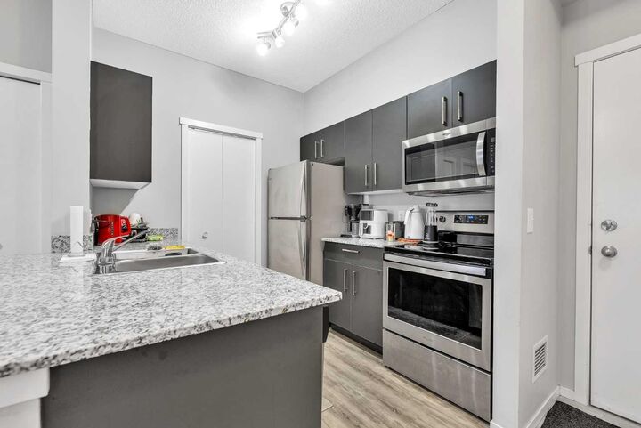 Property Photo: 4641 128 Avenue NE 1613 AB T3N 1T2