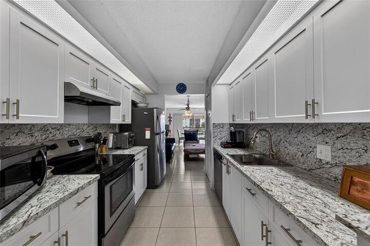 Property Photo:  12750 SW 15th Street 303 D  FL 33027 