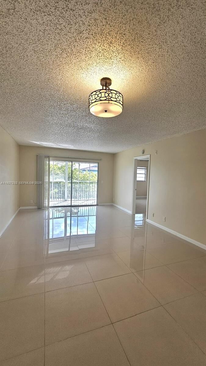 Property Photo:  1401 SW 128th Ter 410H  FL 33027 