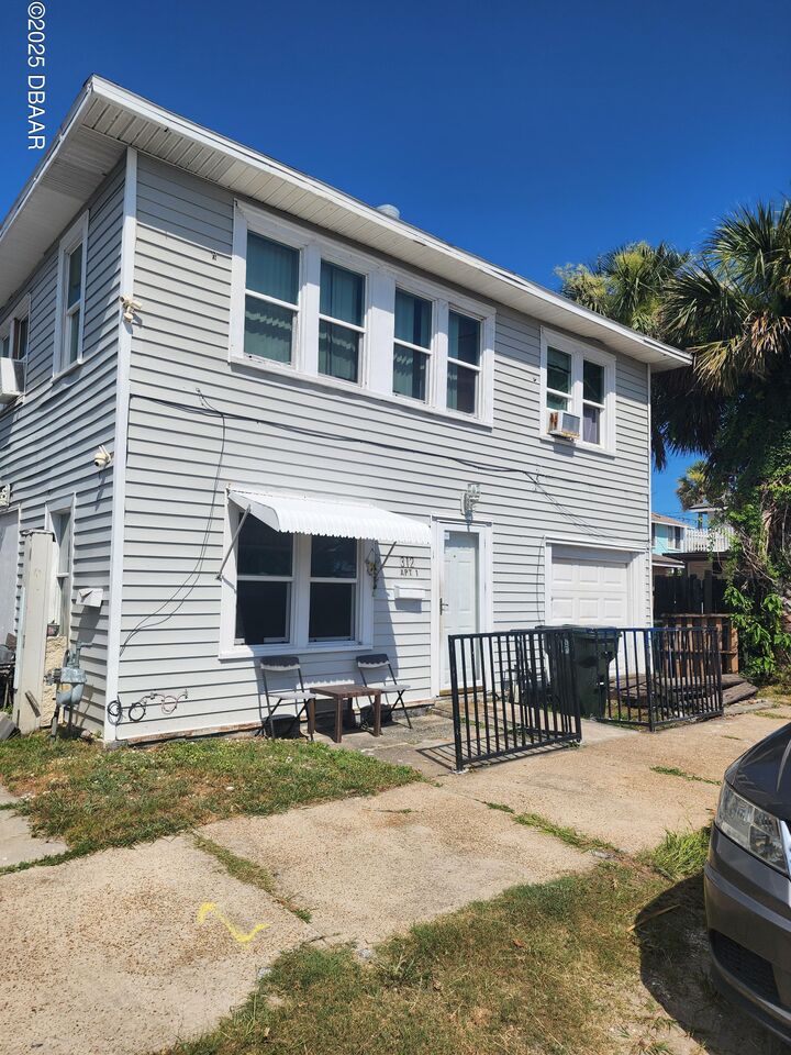 Property Photo: 312 N Wild Olive Avenue FL 32118