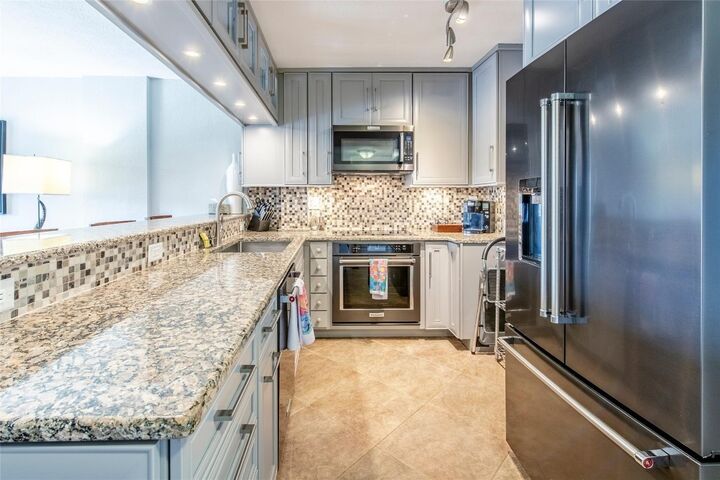 Property Photo:  1831 NE 38th Street 206  FL 33308 