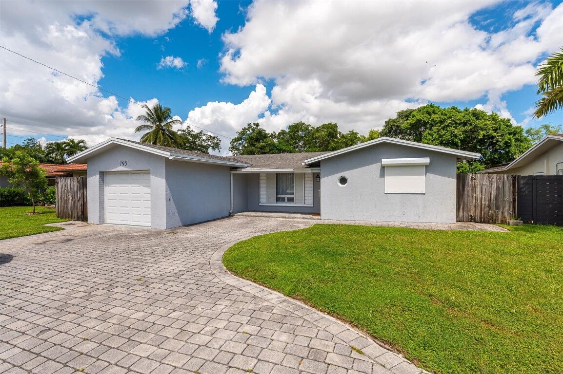 Property Photo:  795 NW 35th Street  FL 33309 