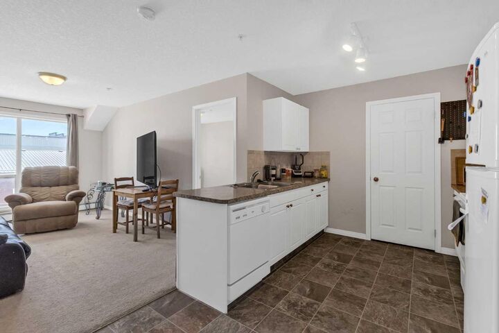 Property Photo: 1010 Railway Street 207 AB T0M 0S0