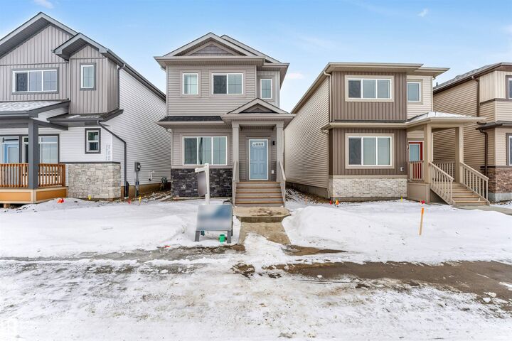 Property Photo: 1027 Aster Boulevard NW AB T6T 2W7