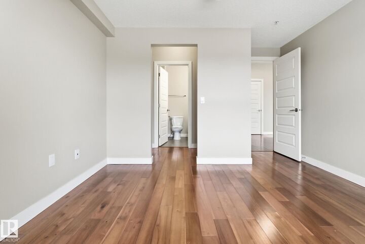 Property Photo: 1238 Windermere Way SW 214 AB T6W 2J3