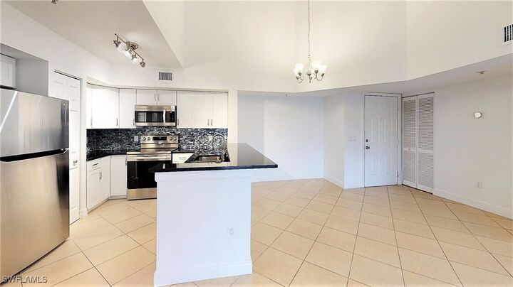 Property Photo:  1210 Wildwood Lakes Boulevard 306  FL 34104 
