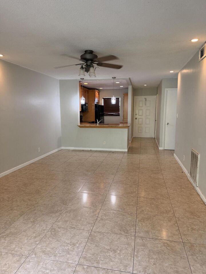 Property Photo:  1400 NE 57th Street 302  FL 33334 