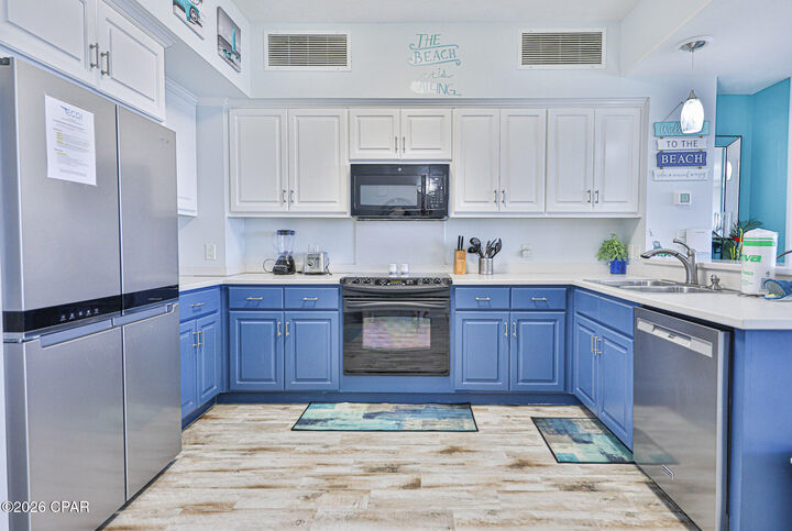 Property Photo:  8715 Surf Drive 2002B  FL 32408 