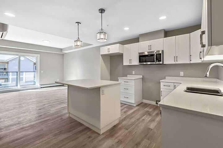 Property Photo: 97 Station Drive 201 AB T4S 0S6