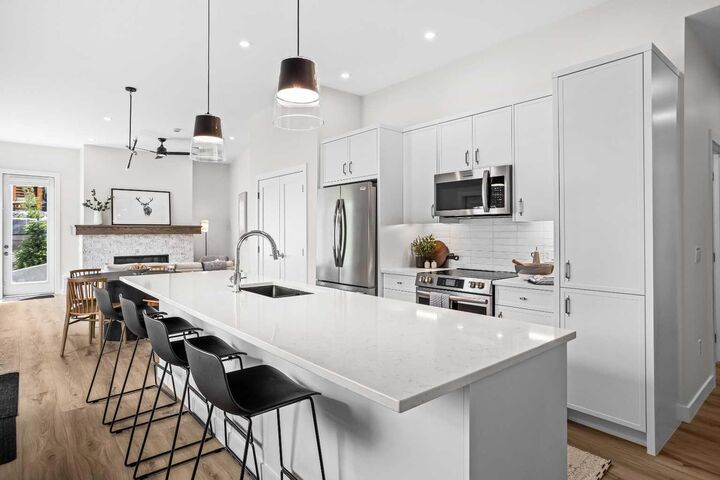 Property Photo:  209 Stewart Creek Rise 101K  AB T1W 0N9 