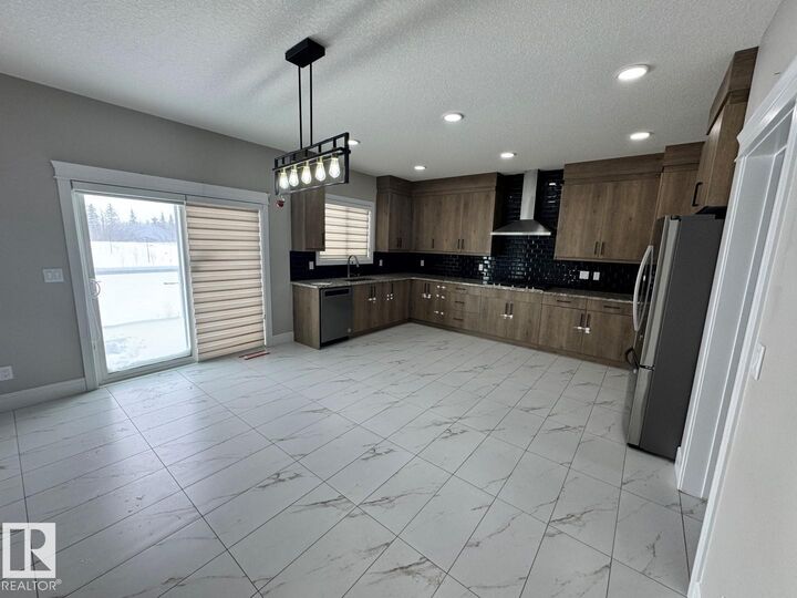 Property Photo: 8729 Mayday Lane SW AB T6X 2L3