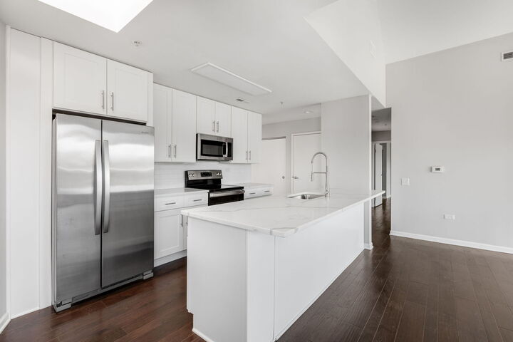 Property Photo:  1800 Dewes Street 310  IL 60025 