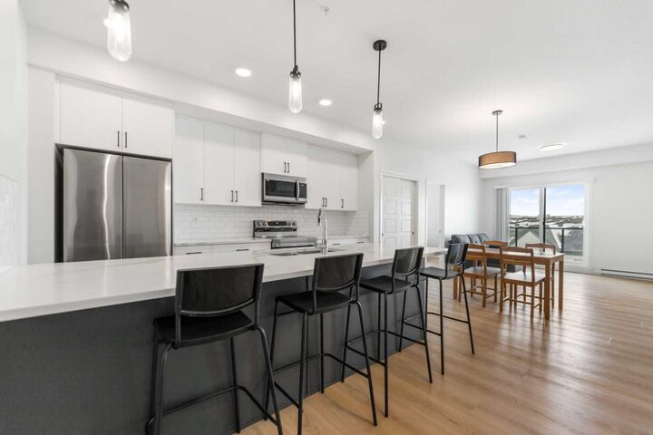 Property Photo: 20295 Seton Way SE 6403 AB T3M 3Y7