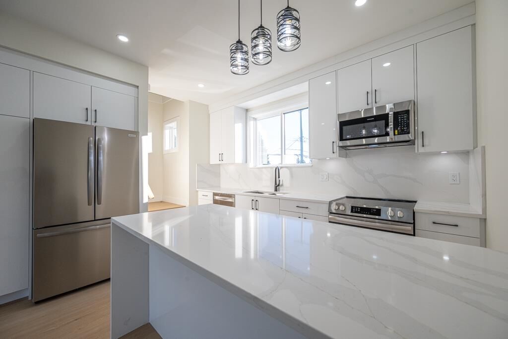 Property Photo:  7533 Wren Street B  BC V2V 3C1 