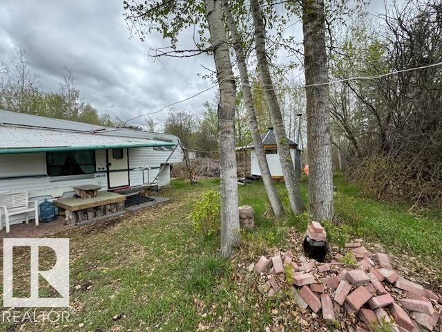 Property Photo: 321 254053 Twp Rd 460 AB T9A 1W8