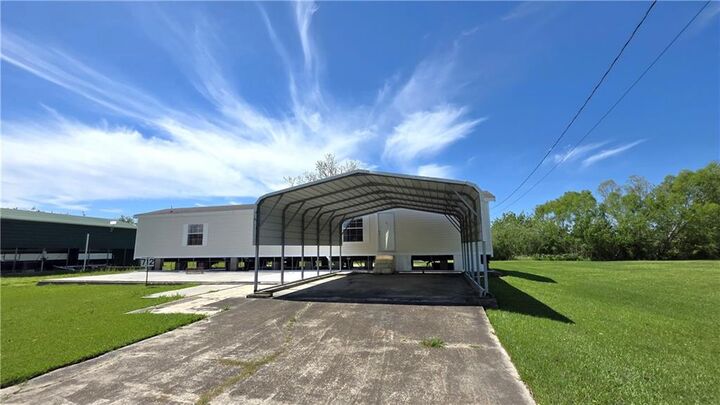 Property Photo:  712 Buras River Road  LA 70041 