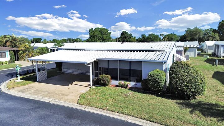 Property Photo:  12501 Ulmerton Road 77  FL 33774 