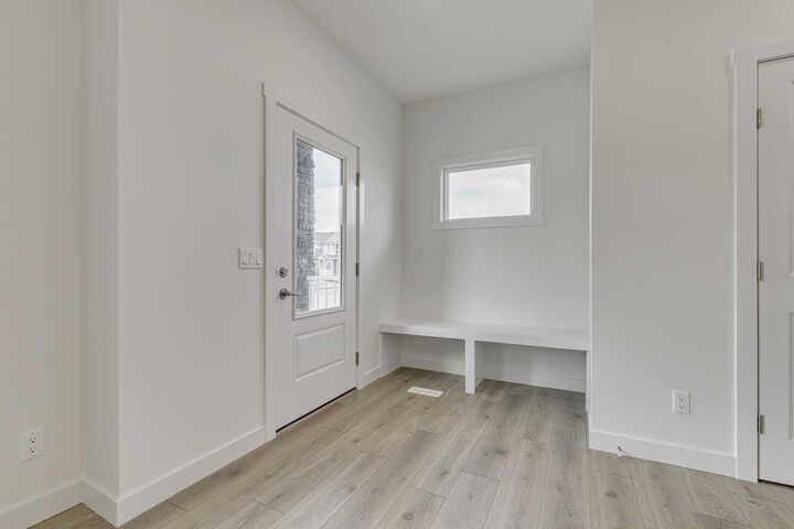 Property Photo: 208 Belmont Way SW AB T2X 5T5