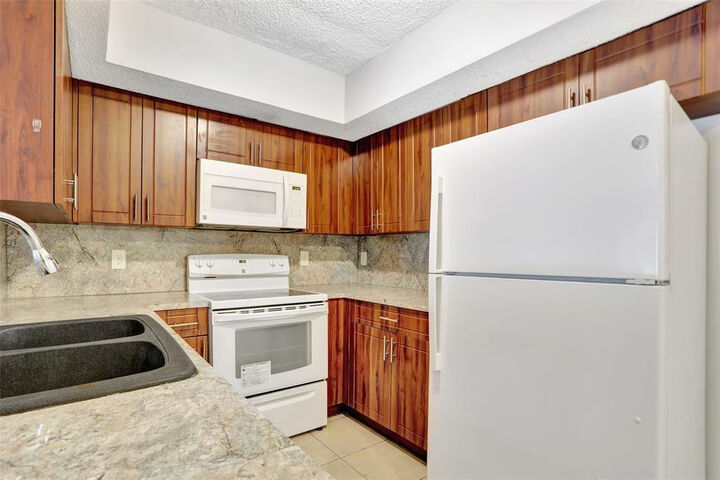 Property Photo:  5590 NW 61st Street 803  FL 33073 