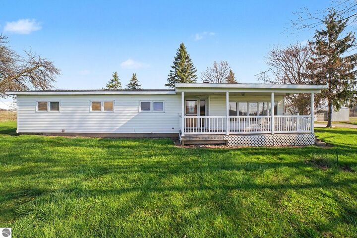 Property Photo:  115 E River Road  MI 48858 