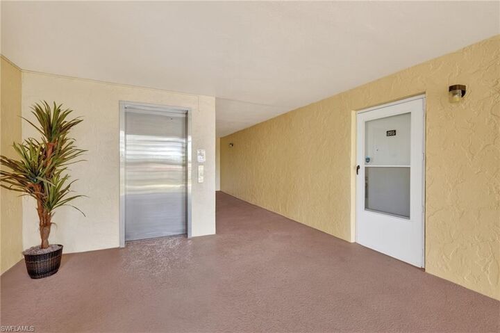 Property Photo:  1084 Forest Lakes Dr 7205  FL 34105 