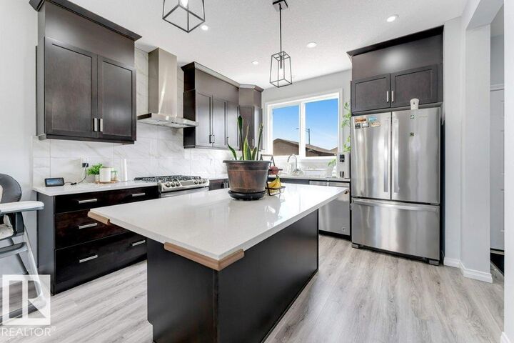 Property Photo: 1305 Darby Way SW AB T6W 4N3