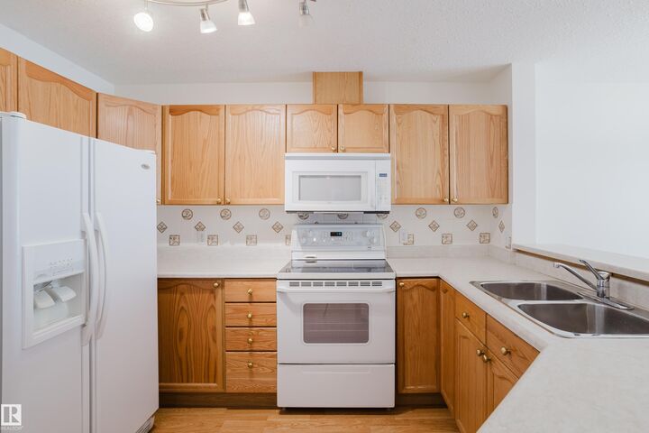 Property Photo:  4312 139 Avenue NW 201  AB T5Y 3J4 