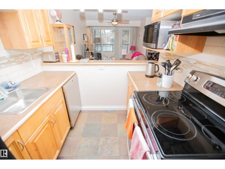 Property Photo:  #213 11033 127 St NW  AB T5M 0T3 