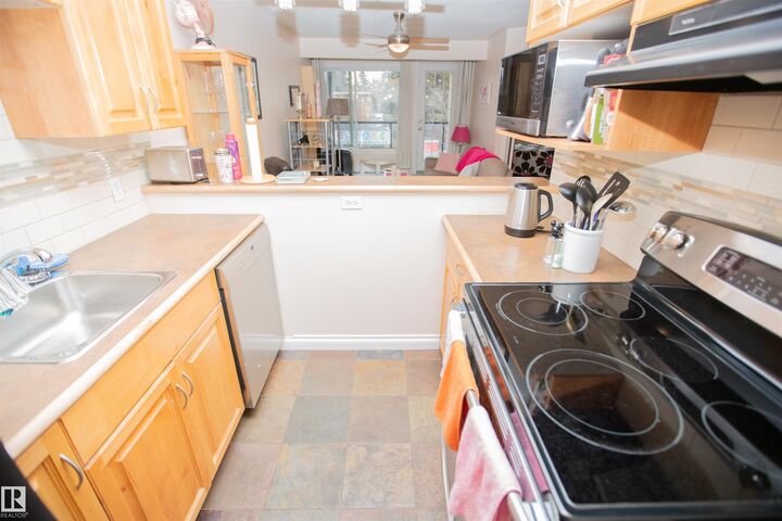 Property Photo:  11033 127 Street NW 213  AB T5M 0T3 