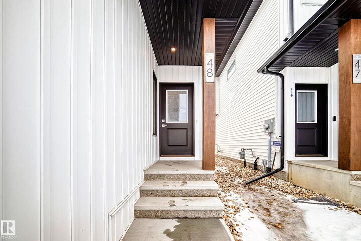 Property Photo:  5122 213A Street NW 48  AB T6M 1M6 