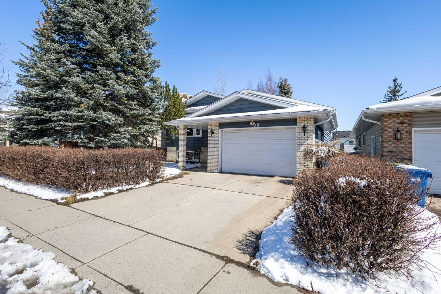 Property Photo:  108                  Woodmont Drive SW  AB T2W 4M3 