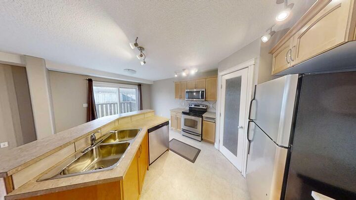 Property Photo:  9062 131 Avenue  AB T8X 0A9 
