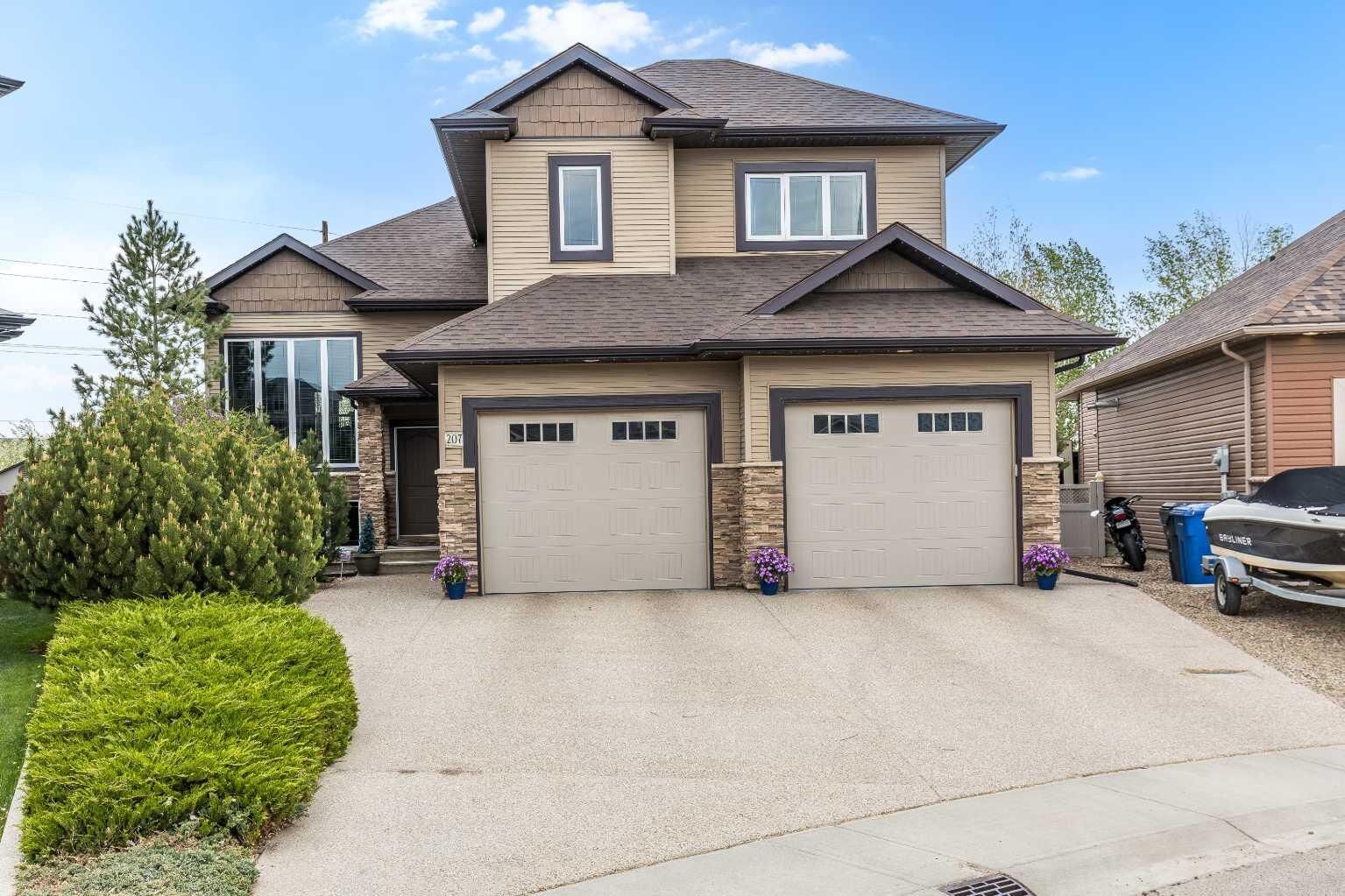 Property Photo:  207 Hamptons Way SE  AB T1B 0E1 